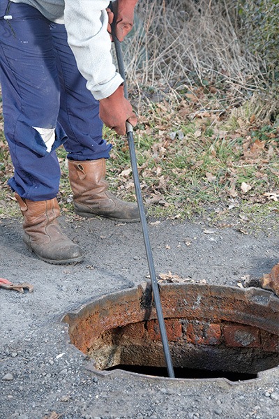 Man providing septic tank maintenance service