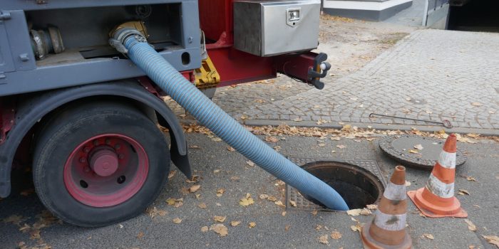 Pumping Off The Sewage Tank Of A Mobile Sanitary Container Into The Sewage System